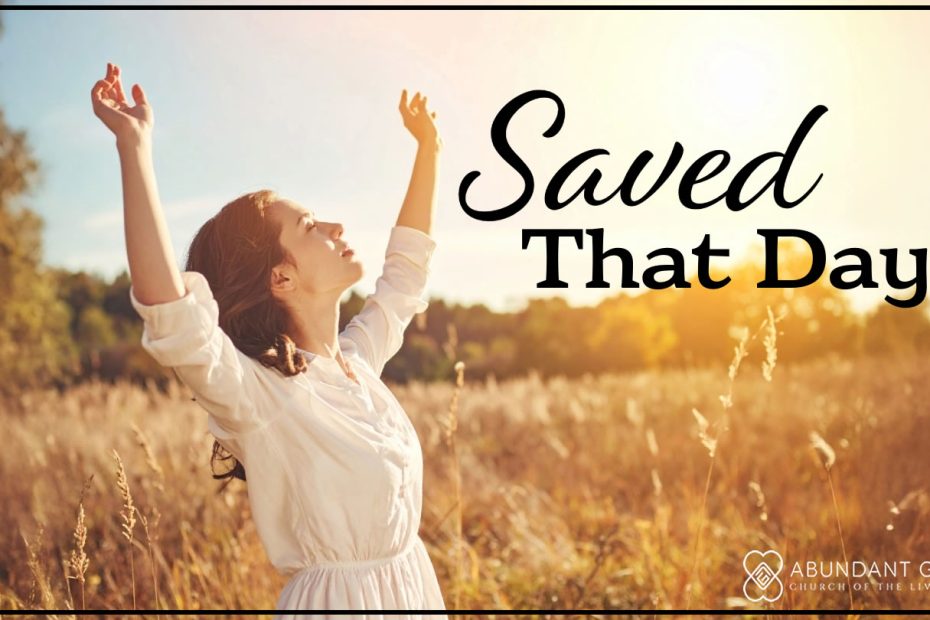 photograph of a young woman with hands lifted in the air and looking up into the sky in a field on a fall day