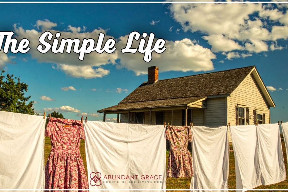 clothes drying outside on a line in the backyard of a house built in the 1960s in the country on sunny day with blue skies and white clouds.
