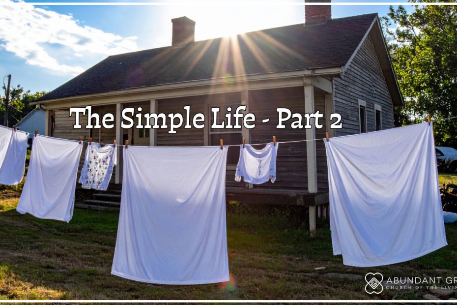 clothes drying outside on a line in the backyard of a house built in the 1960s in the country on sunny day with blue skies and white clouds.