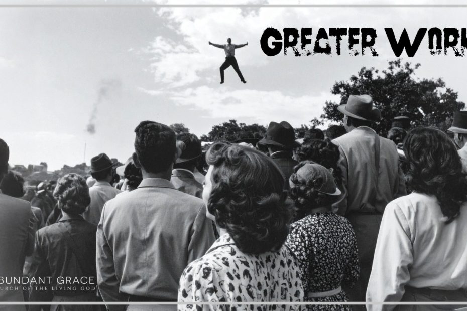 A man suspended in the air in the 1960s with a crowd watching